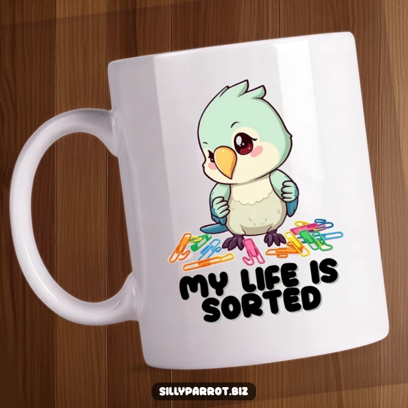 Funny mug with a focused parrot character meticulously organizing a vibrant pile of colorful paper clips with its beak and wing.
